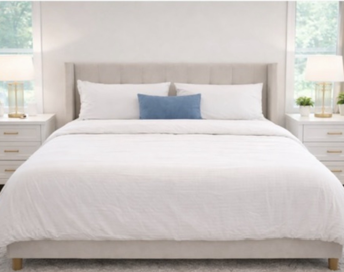 A made bedroom, quietly cared for