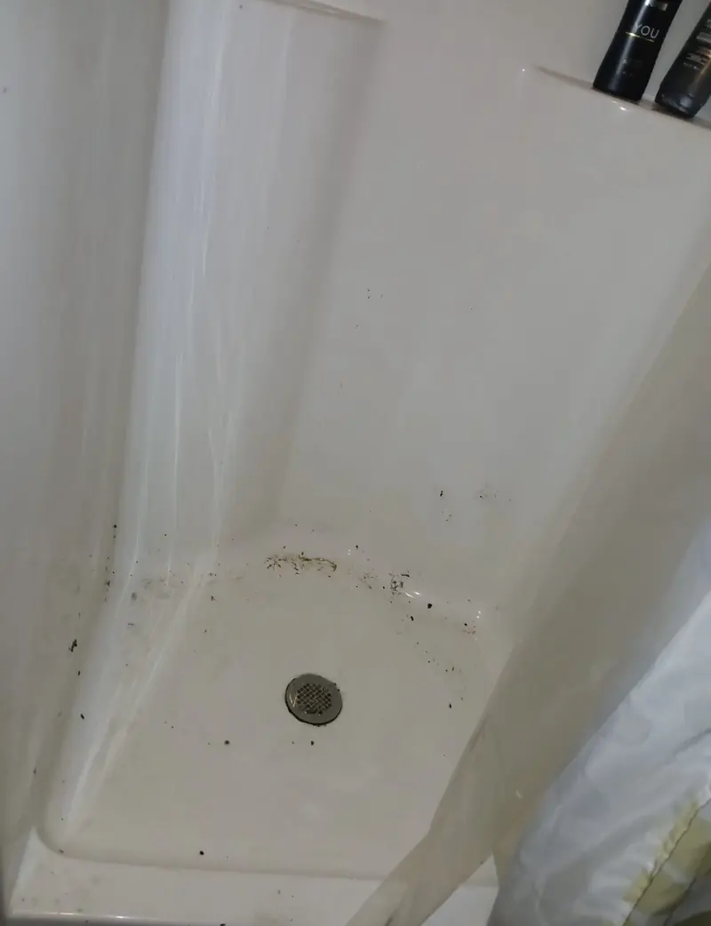 Shower floor before and after a deep clean