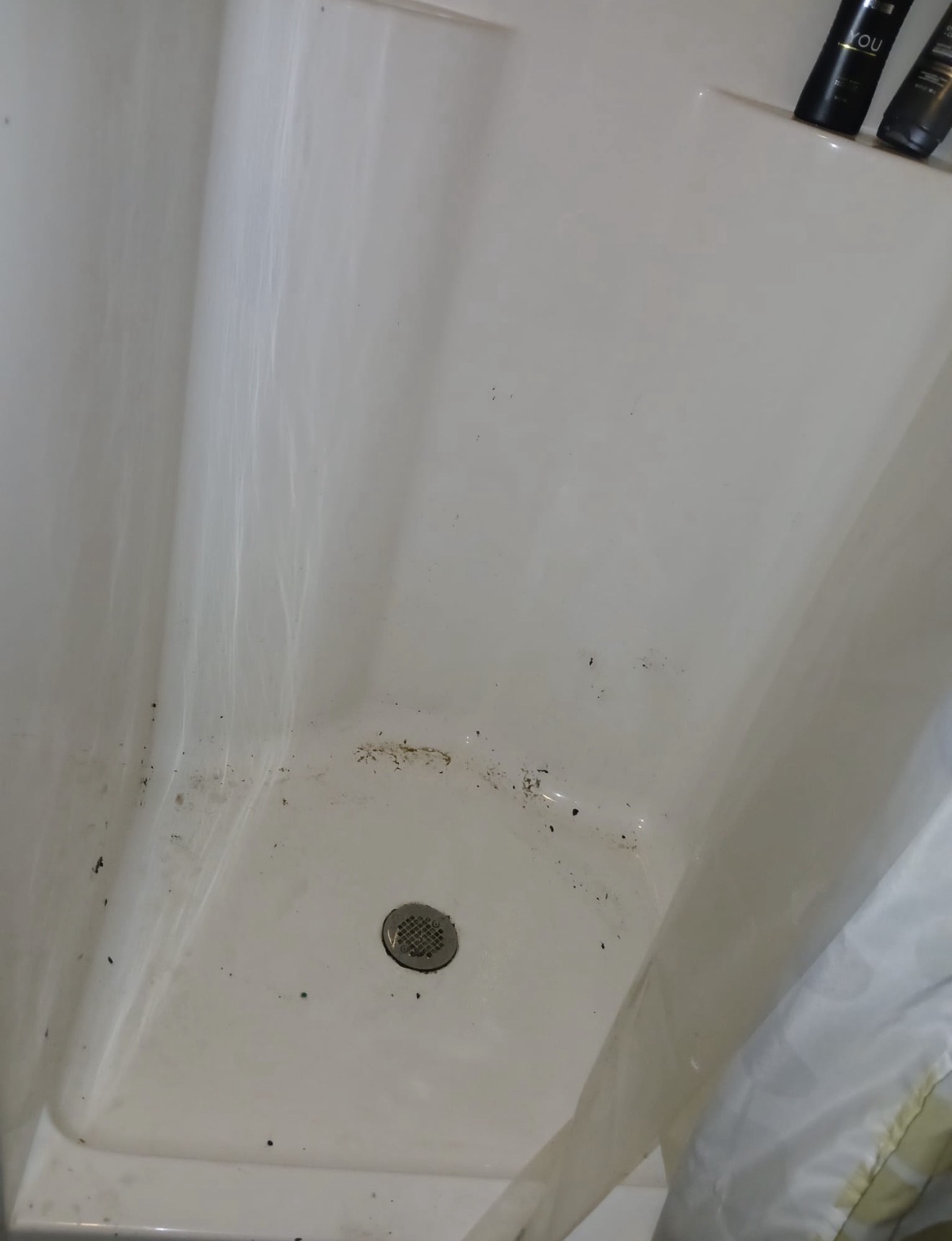 Shower floor before and after deep clean
